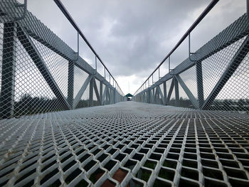 View of bridge against cloudy sky