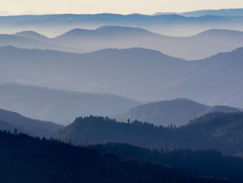 Scenic view of silhouette mountains against sky at sunset