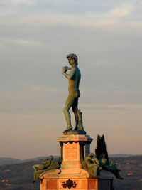 Statue in front of building