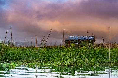 Scenic view of lake against sky during sunset