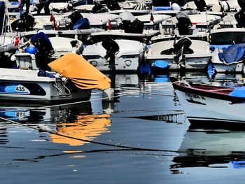 Boats moored at harbor