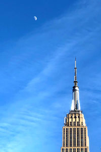 Low angle view of buildings against blue sky