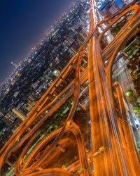 Aerial view of city lit up at night