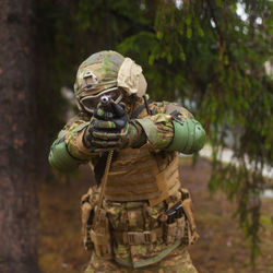 Soldier aiming a pistol ukrainka, kharkiv oblast, ukraine