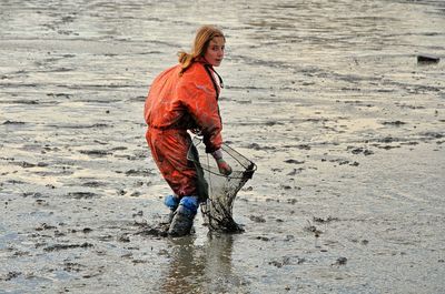 Portrait of man walking on beach