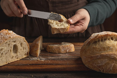 Closeup of homemade bread on table against dark background