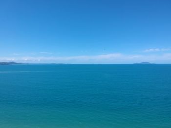 Scenic view of sea against blue sky