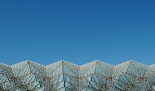 Low angle view of roof against blue sky