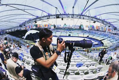 Man photographing at stadium