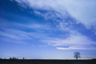 Scenic view of landscape against sky at night