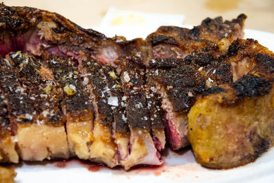 Close-up of meat on barbecue grill