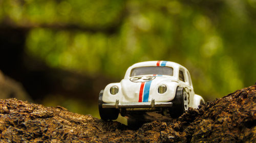 Close-up of toy car on rock