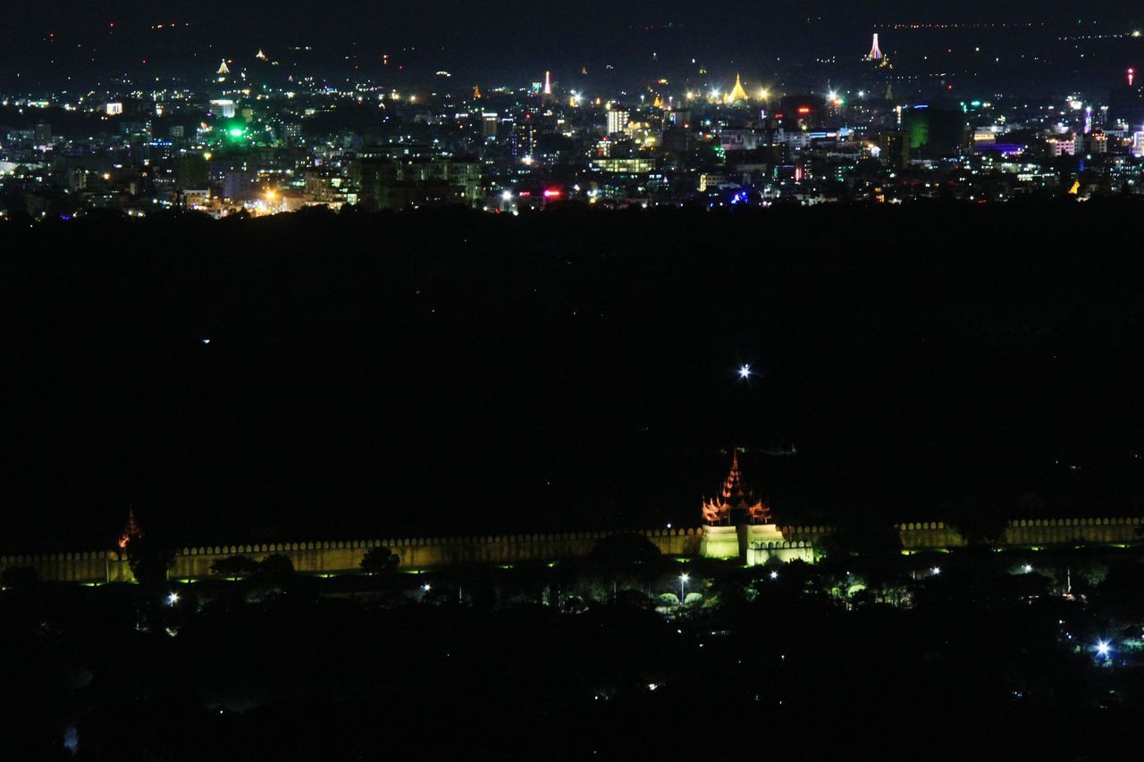 HIGH ANGLE VIEW OF BUILDINGS AT NIGHT