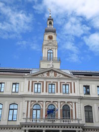 Low angle view of riga city council against sky