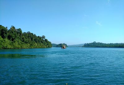 Scenic view of sea against clear blue sky