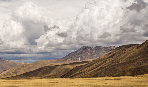 Scenic view of landscape against cloudy sky