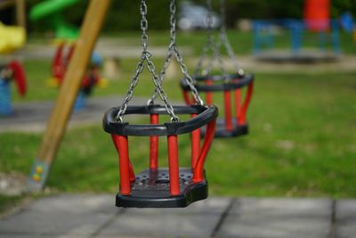 Close-up of swing in park