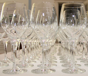 Close-up of wine glasses on table