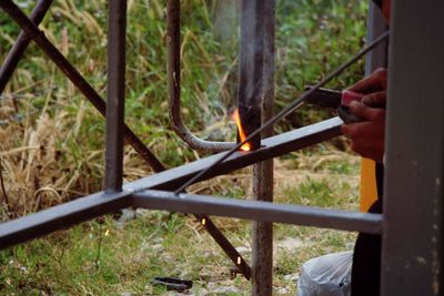 Cropped image of man welding metal