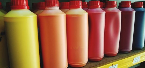 Close-up of bottles in row