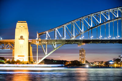 Low angle view of bridge over river against sky