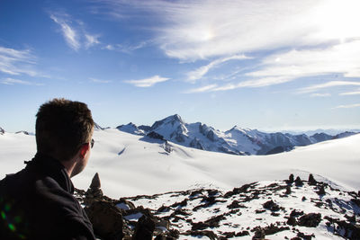 Scenic view of snow covered mountains against sky