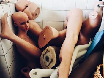 High angle view of abandoned mannequins in bathroom