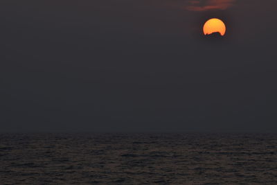 Scenic view of sea against sky at sunset