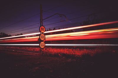 Light trails on railroad tracks at night