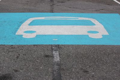 High angle view of arrow sign on road