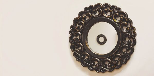 Close-up of ornate object over white background