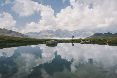 Panoramic view of lake and mountains against sky