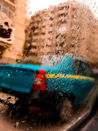 Close-up of wet glass window in rainy season