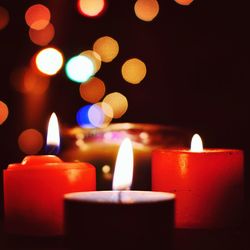 Close-up of illuminated tea light candles