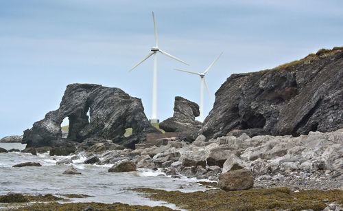 Traditional windmill against sky