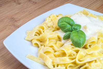 High angle view of pasta in plate on table