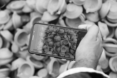 Close-up of man using mobile phone outdoors