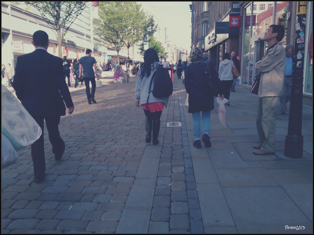 men, walking, person, transfer print, street, building exterior, city, city life, architecture, lifestyles, large group of people, built structure, rear view, medium group of people, auto post production filter, full length, group of people, sidewalk, cobblestone