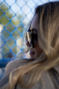 Close-up of young woman wearing sunglasses