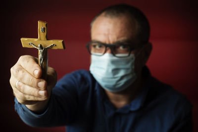 Close-up portrait of man wearing mask
