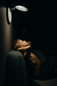 Boy resting on sofa at home