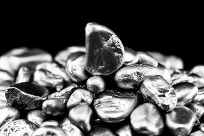 Close-up of roasted coffee beans against black background