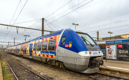 Train on railroad station platform against sky