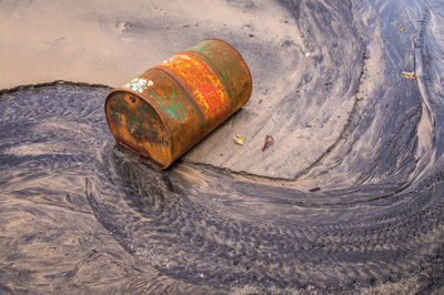 High angle view of rusty metal on beach