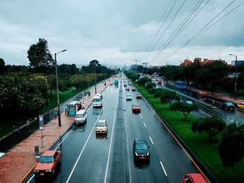 High angle view of cars moving on road in city