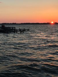 Scenic view of sea against clear sky during sunset