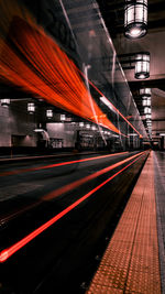 Train at railroad station at night long exposure 