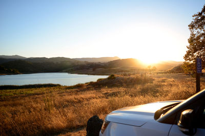 Scenic view of mountains against clear sky during sunset