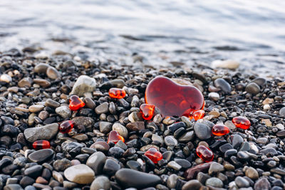 High angle view of stones with heart shapes at beach