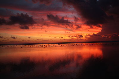 Scenic view of sea against romantic sky at sunset